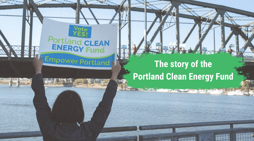 Just Solutions article by Zully Juarez on PCEF featured image of a person holding up a sign that says "Yes! Portland Clean Energy Fund. Empower Portland"