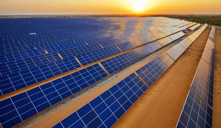 Just Solutions article by Zully Juarez featured image of solar panel field with sunset in background